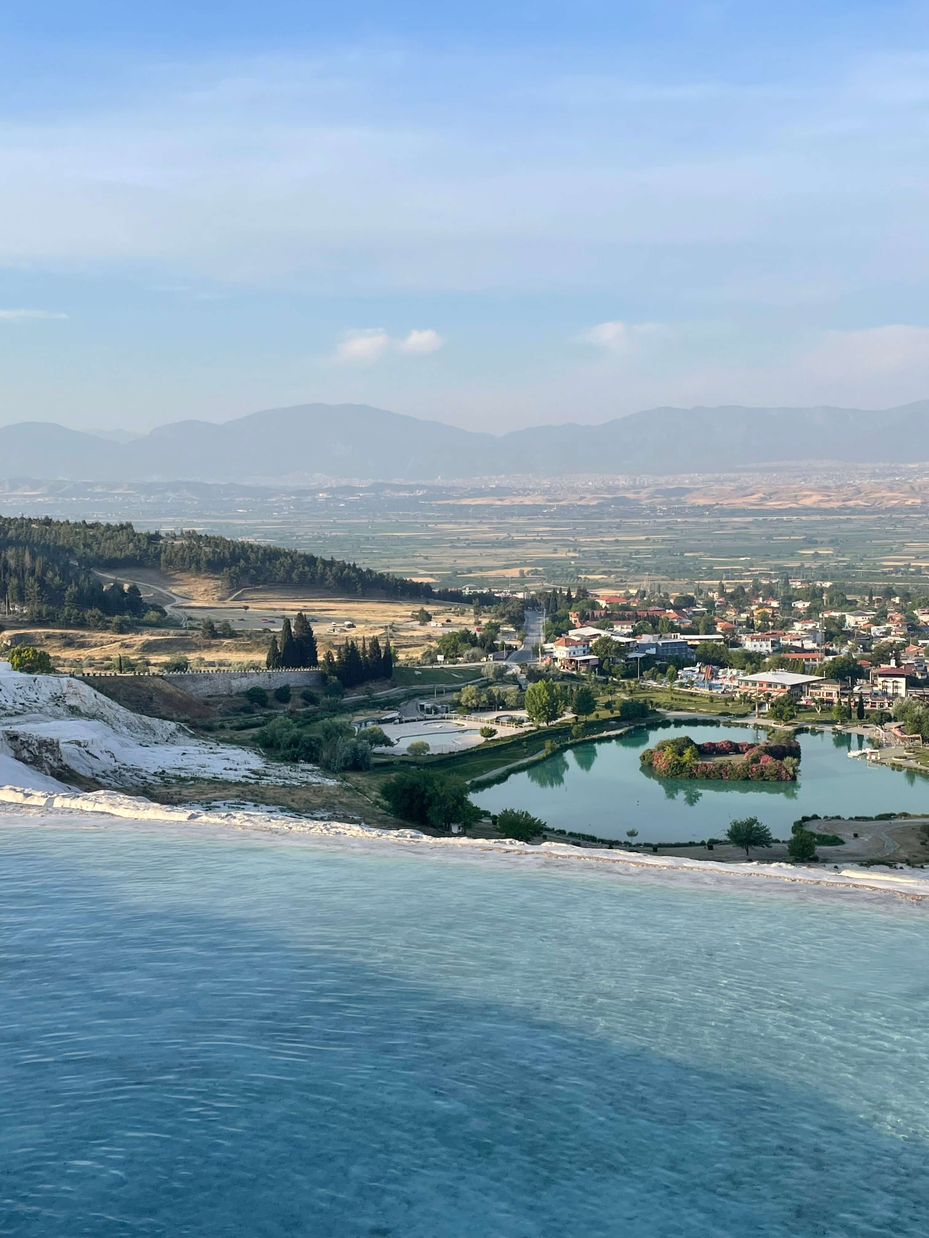 Stunning views over the travertines and nearby mountains and valleys